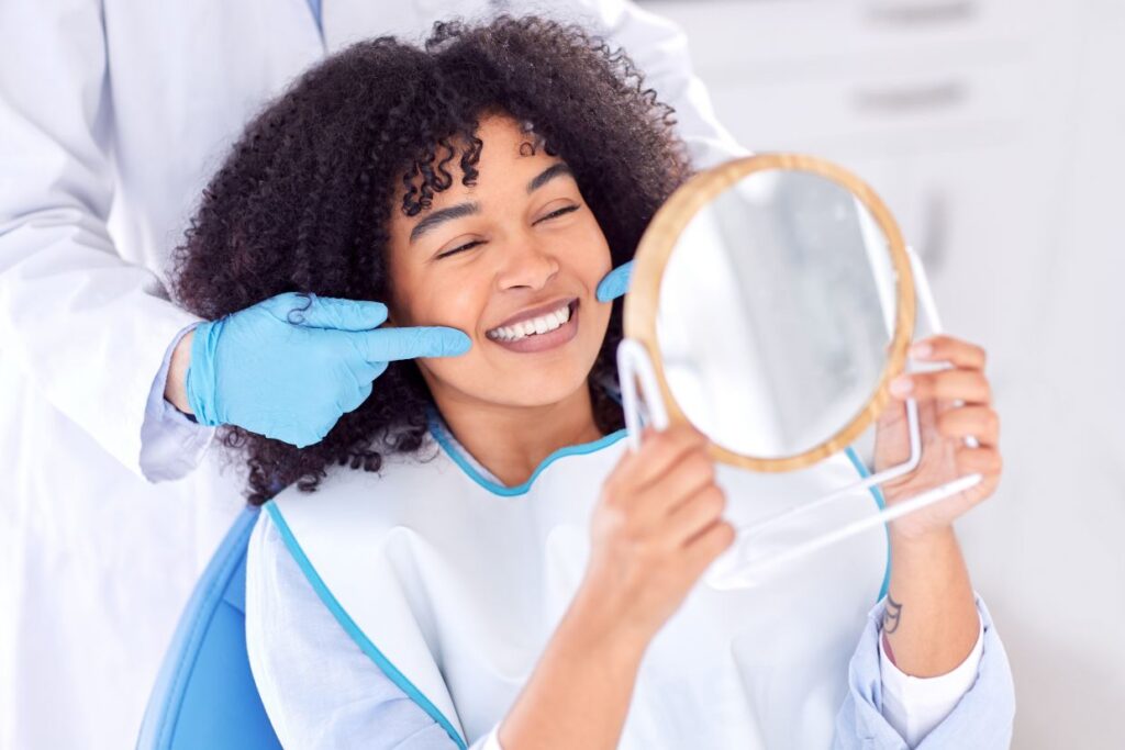 happy woman at dentist appointment smiling